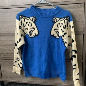 Leopard sleeve sweater will be donated 5/2024